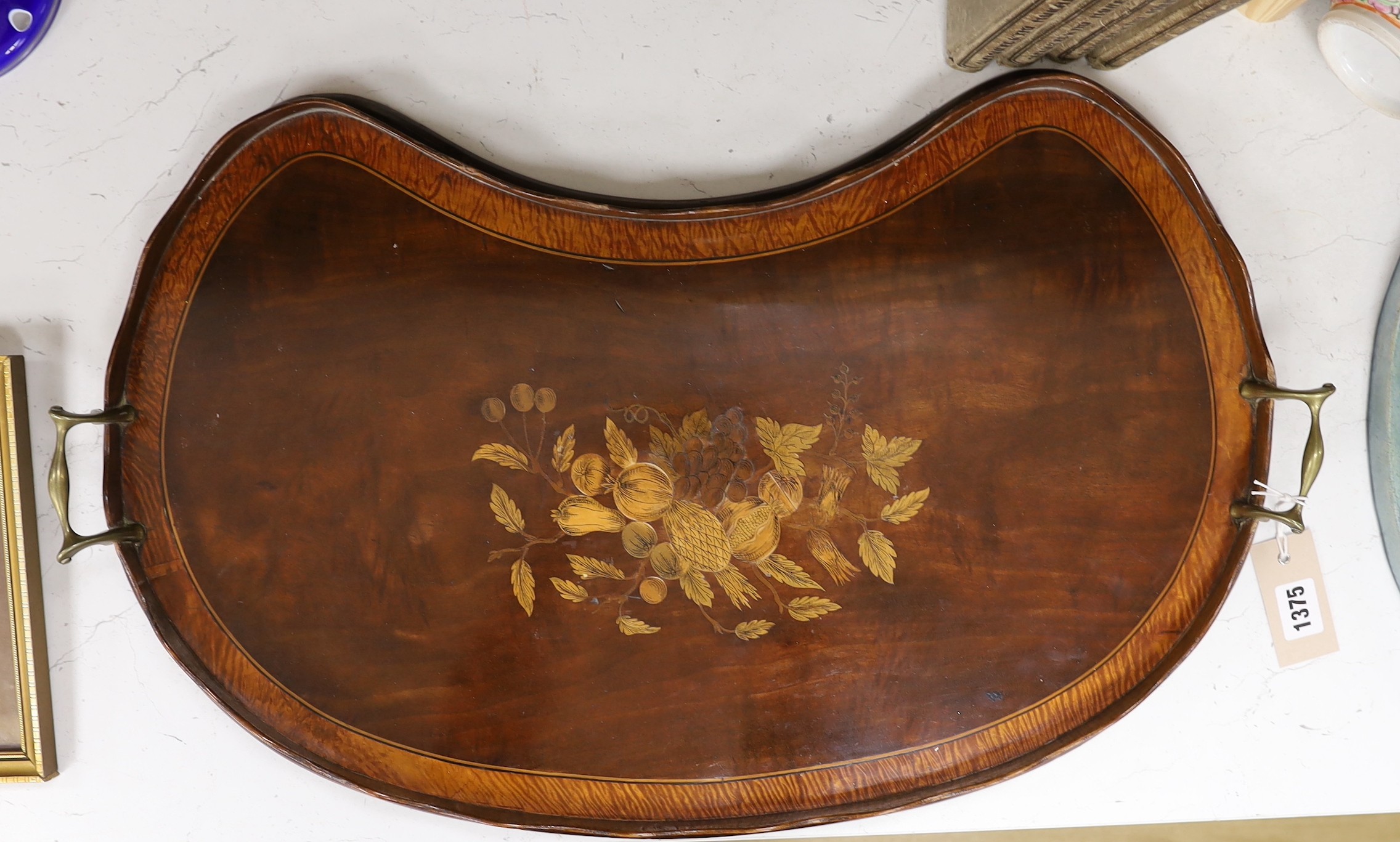 An Edwardian kidney shape mahogany and marquetry tray. 65cm wide